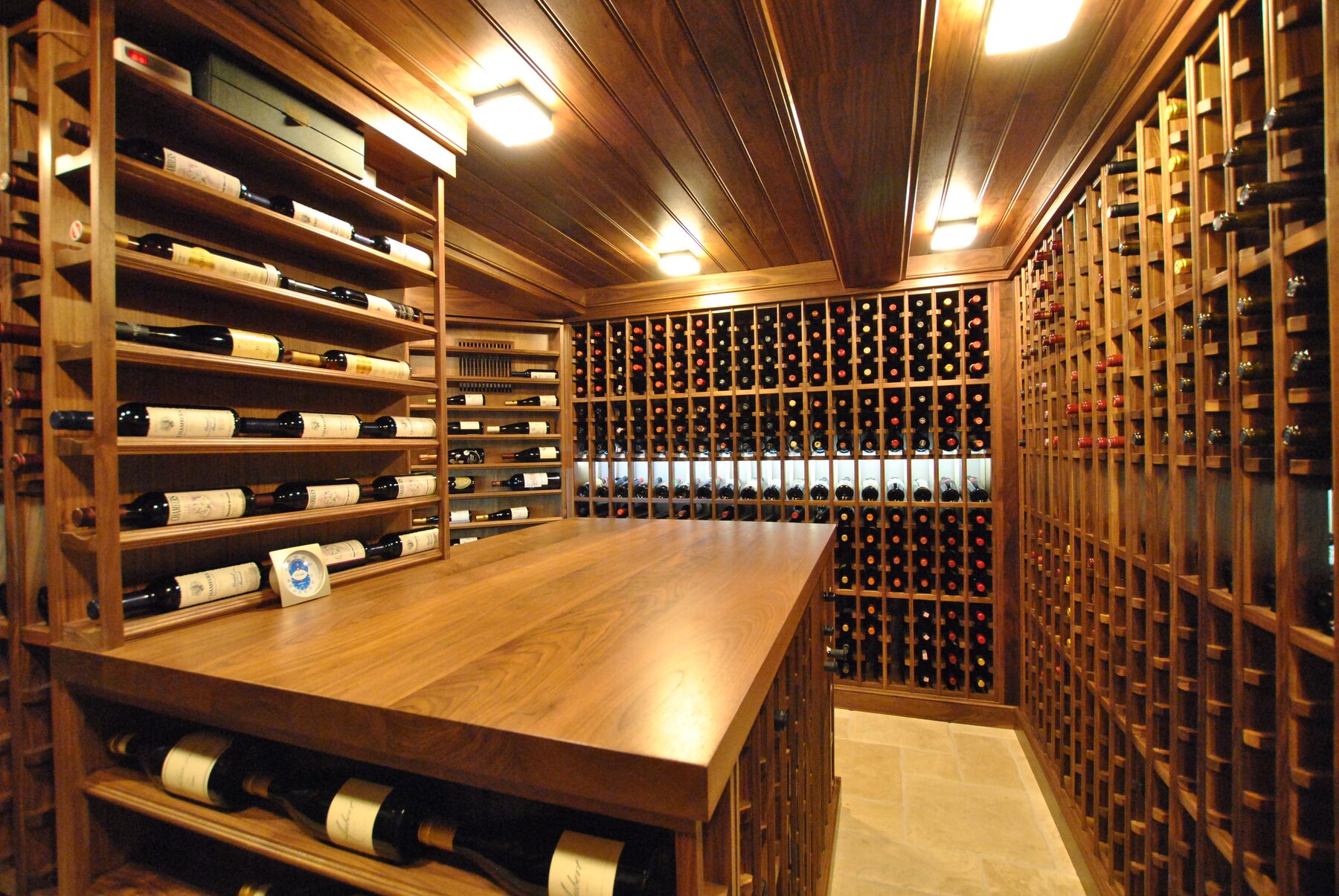 Custom walnut wine cellar with tasting table